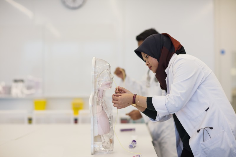 Student practicing medical procedure (nasogastric tube)