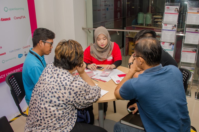 Counselors explaining to prospective students