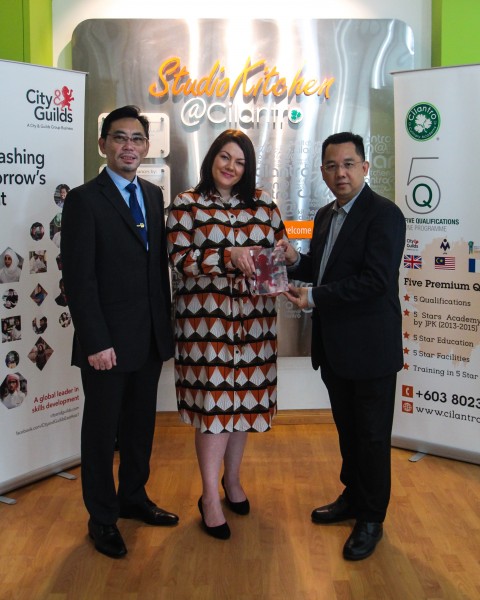 City & Guilds' head of international sales operation Ayesha Rees (middle) presents 'The International Centre of Excellence - Asia Pacific' award to Cilantro's training director Bernard Lee Then Kit (right) and executive pastry chef Chern Chee Hoong (left).