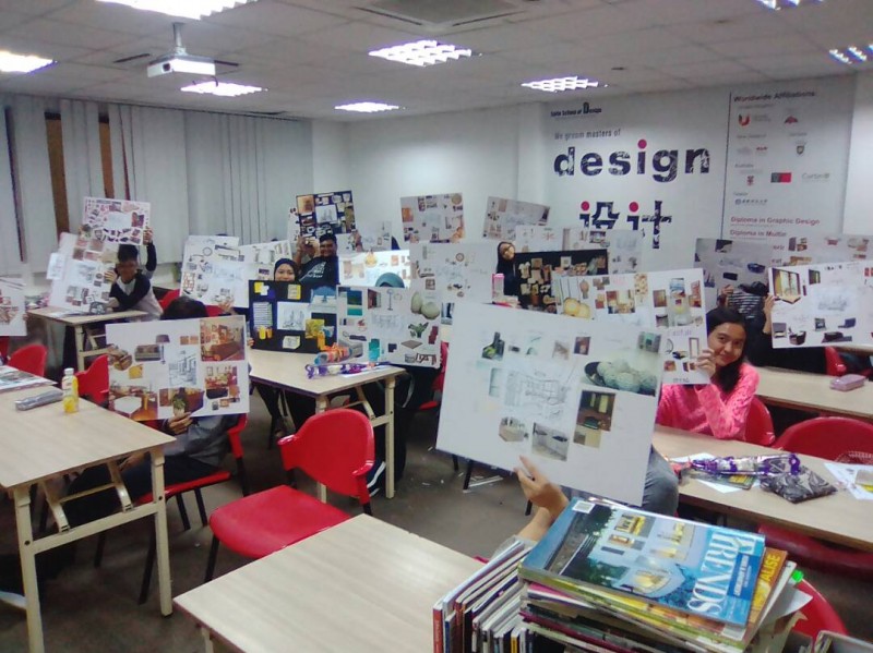 Students showcasing their assignments in a class